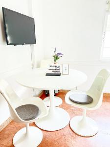Televízia a/alebo spoločenská miestnosť v ubytovaní Happy Apartments Valencia – Lope de Vega