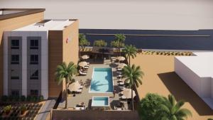 an artist rendering of a proposed hotel with a swimming pool at Candlewood Suites Mesa - Phoenix East by IHG in Mesa