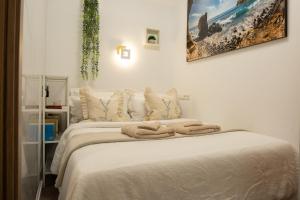 Postel nebo postele na pokoji v ubytování Dom Kubus Playa de Mogán