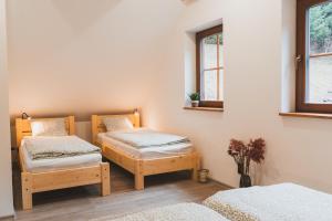 Postel nebo postele na pokoji v ubytování Wellness Chalupa Krajanka