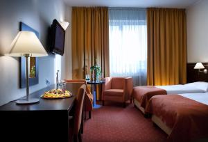 Postel nebo postele na pokoji v ubytování Hotel Tatra