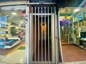 a store entrance with a gate in a store at Habitación Privada Chia Centro Luna Serena in Chía