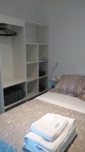 a bedroom with a bed with white towels on it at Casitas del Lago in Potrero de Garay +11 photos