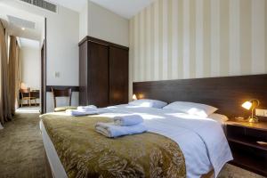 Postel nebo postele na pokoji v ubytování Citrus Hotel