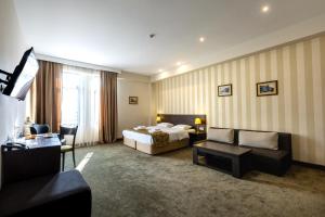 Postel nebo postele na pokoji v ubytování Citrus Hotel