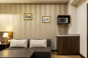 TV a/nebo společenská místnost v ubytování Citrus Hotel