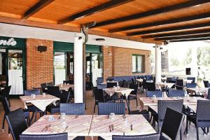 a dining room with tables and chairs at Villa in Cecina Mare near Sandy Beaches in Marina di Cecina