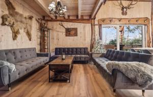 a living room with leather couches and a table at Gorgeous Home In Harzgerode With Wifi in Harzgerode