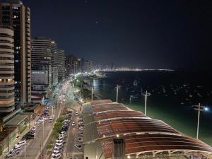 a view of a city at night with a street at Apartamento de luxo na Beira Mar in Fortaleza
