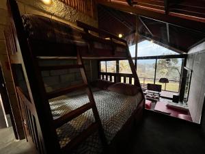 a bedroom with a bunk bed in a room at Chalet Zen Bella Vista in San Juan