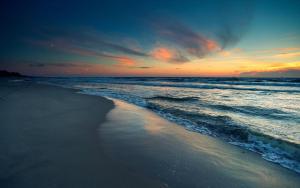 a view of the ocean at sunset with a beach at Zīriņi in Kolka +12 photos