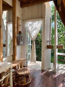 Balkón nebo terasa v ubytování Dreamer Cabin Tre house Dalat + 29 fotografií