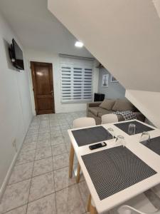 a living room with a table and a couch at Casa Pino in Río Gallegos