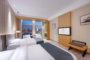 Chengdu Yunhao High-altitude Hotel客房内的一张或多张床位