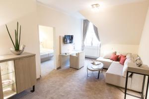 TV a/nebo společenská místnost v ubytování Hermes Hotel Oldenburg