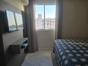 Katil atau katil-katil dalam bilik di Cobertura com vista espetacular para o mar jacuzzi e churrasqueira
