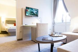 Postel nebo postele na pokoji v ubytování Hermes Hotel Oldenburg