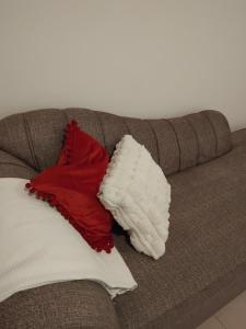 two pillows sitting on top of a couch at Millan home stay Nyali in Mombasa
