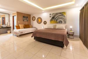 Postel nebo postele na pokoji v ubytování Ganesh Beach Hotel