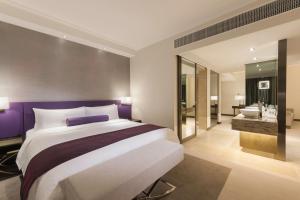 Krevet ili kreveti u jedinici u objektu Gateway Hotel, Marco Polo