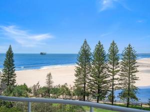 a view of a beach with a boat in the water at Waterview Resort in Caloundra