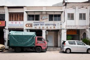a red truck parked in front of a building at Aayu Beach St - George Town Penang in George Town +22 photos