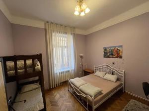Postel nebo postele na pokoji v ubytování Centrum Hostel