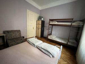 Postel nebo postele na pokoji v ubytování Centrum Hostel