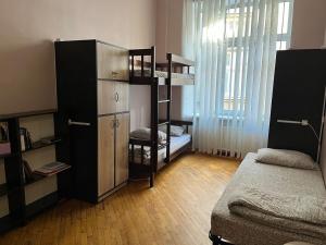 Postel nebo postele na pokoji v ubytování Centrum Hostel