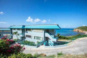 a house with a view of the ocean at Beautiful Ocean Views Amazing Sunsets three pool! in Nazareth