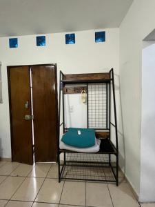 Una cama o camas en una habitación de Hotel Perla Mazatlan