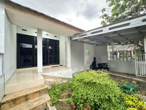 a view of a house with a patio at Omah Putih Homestay Jogja in Jarakan