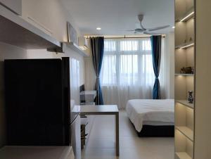 Ένα ή περισσότερα κρεβάτια σε δωμάτιο στο Urban Riverview Couple Suite - Riverine Kuching