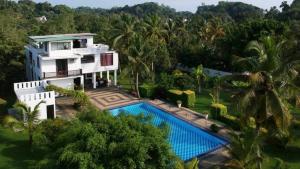 an aerial view of a house with a swimming pool at Shades Hotel & Villa in Matara