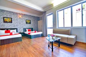 Postel nebo postele na pokoji v ubytování S79 Quynh Giang Airport Hotel
