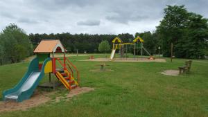 a park with a playground with a slide at Tipi Dakota des monteaux in Vivy