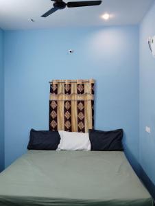 Katil atau katil-katil dalam bilik di Grey stone Farm homestay