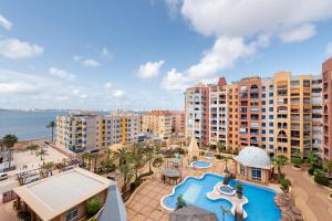 an aerial view of a resort with a swimming pool at VERDEMAR 3, PLAYA HONDA in Cabo de Palos