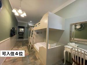 Posteľ alebo postele v izbe v ubytovaní 臺南安平 -安平安逸民宿 Anping Guest House