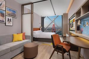 Voodi või voodid majutusasutuse Home2 Suite by Hilton Chongqing Wanzhou toas