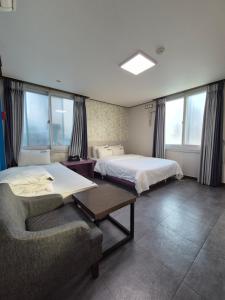 Postel nebo postele na pokoji v ubytování Haruae hotel