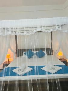 Letto o letti in una camera di JO Residence - Tangalle