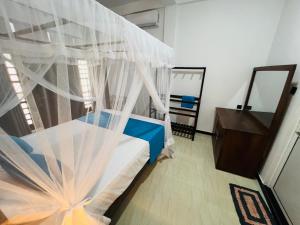 Letto o letti in una camera di JO Residence - Tangalle