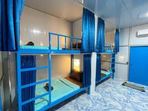 Μία ή περισσότερες κουκέτες σε δωμάτιο στο Blue Shore Pavilion