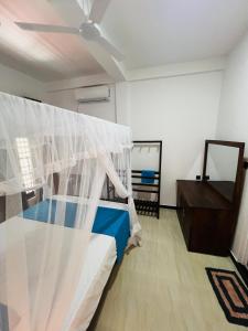 Letto o letti in una camera di JO Residence - Tangalle