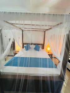 Letto o letti in una camera di JO Residence - Tangalle