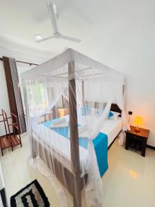 Letto o letti in una camera di JO Residence - Tangalle