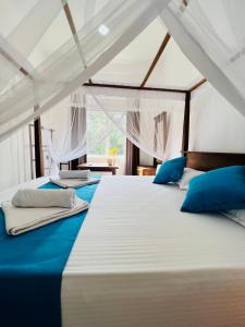 Postel nebo postele na pokoji v ubytování JO Residence - Tangalle