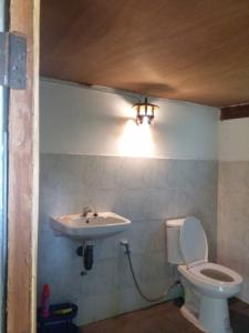 a bathroom with a toilet and a sink at Farmer house on Beverley hill Pai in Pai