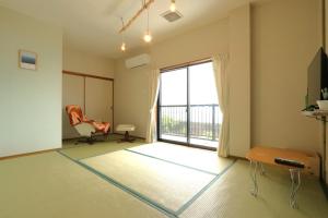 Televisyen dan/atau pusat hiburan di 民宿たかはま Takahama Guest house